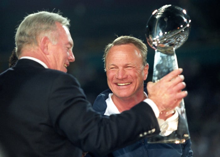 Dallas Cowboys owner Jerry Jones and head coach Barry Switzer hold the Lombardi trophy after a victory against the Pittsburgh Steelers in Super Bowl XXX at Sun Devil Stadium. Dallas defeated Pittsburgh 27-17.